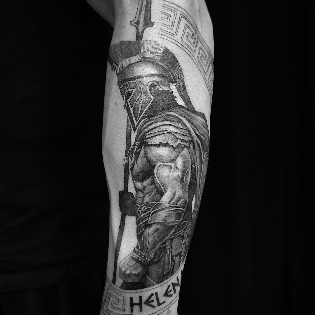 a man with a spartan cover-up tattoo on his arm, paderborn, germany