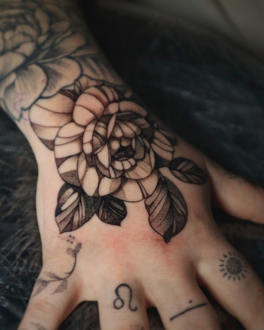 a hand cover-up tattoo with a flower on it, kassel, germany