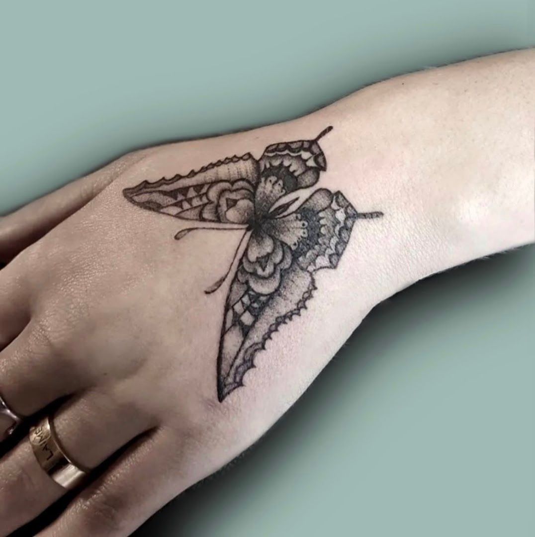 a narben tattoo of a butterfly on the wrist, neunkirchen, germany