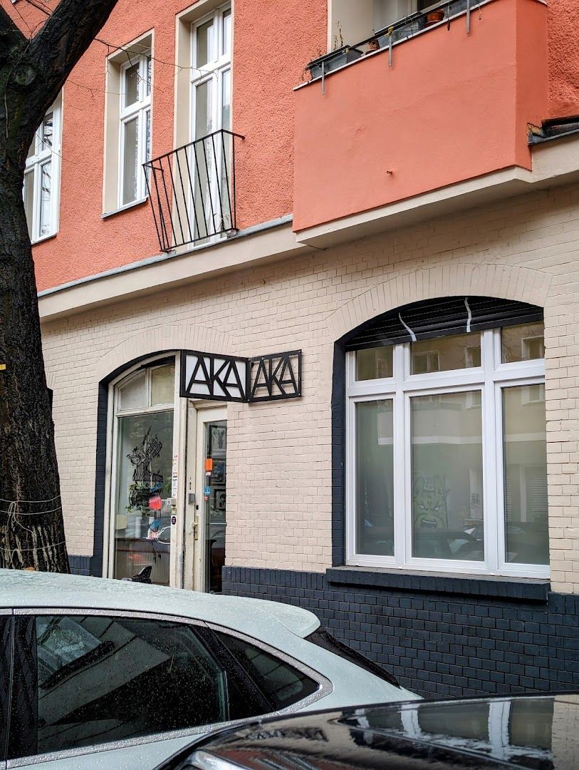 a white car parked in front of a building