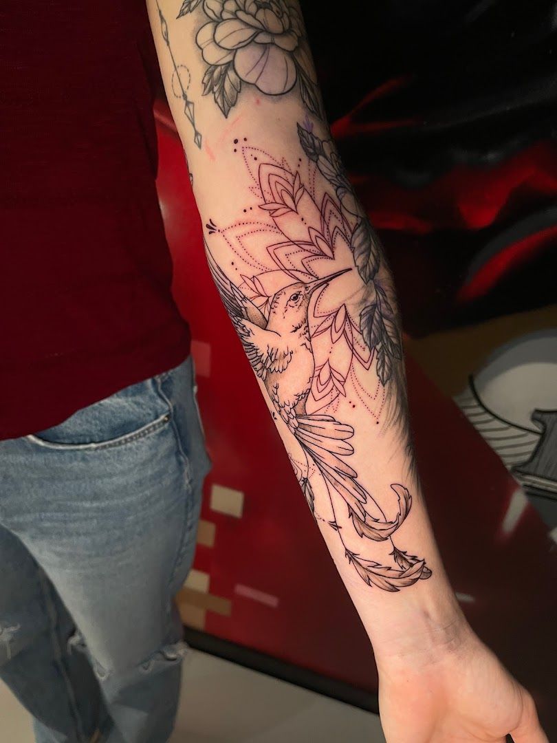 a woman with a cover-up tattoo on her arm, biberach, germany