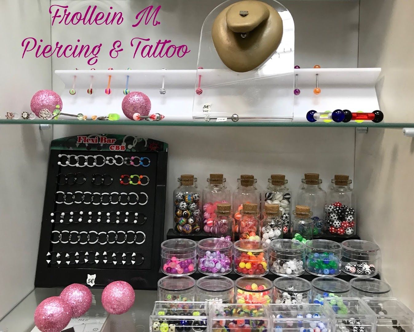 a display case filled with lots of different colored beads