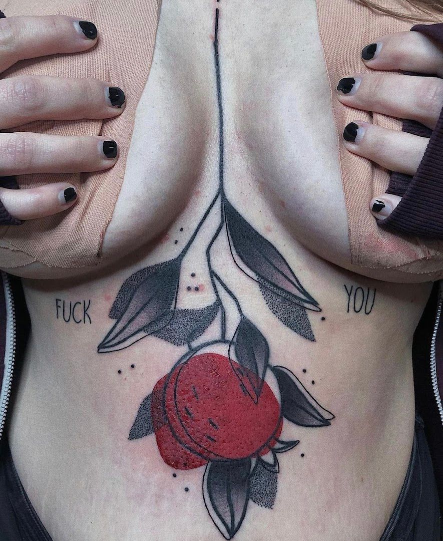 a woman with a rose realistic tattoos on her chest, marburg-biedenkopf, germany