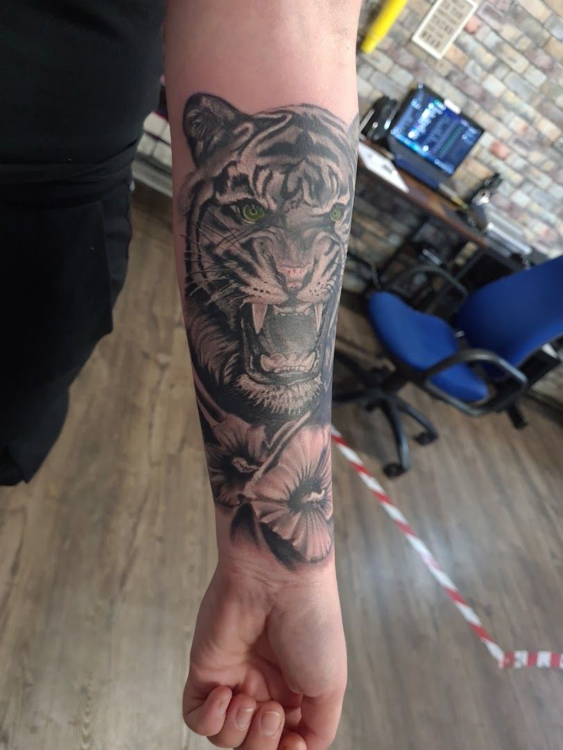 a tiger cover-up tattoo on the arm, neustadt (aisch)-bad windsheim, germany
