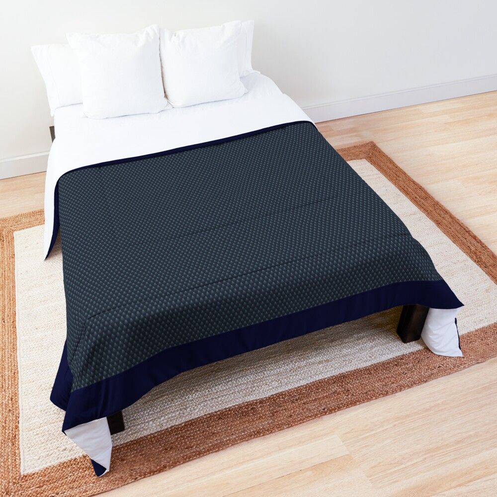 a bed with a black and white pattern