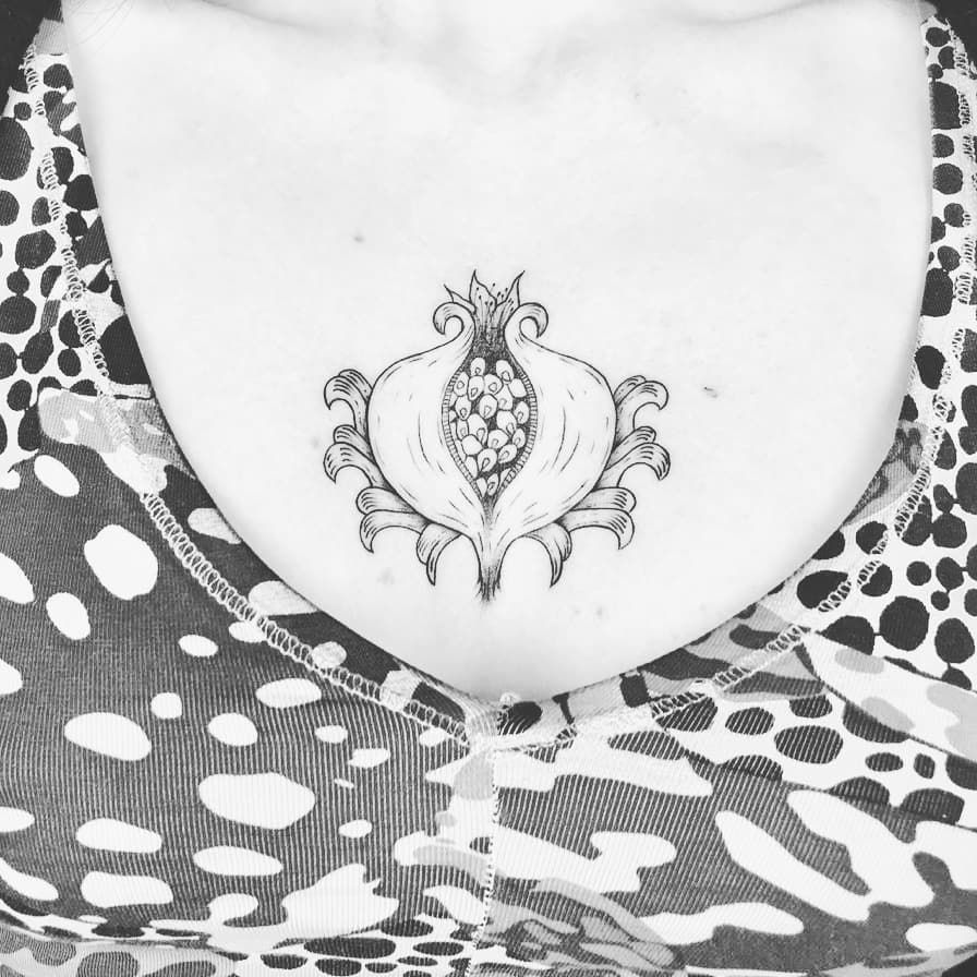 a woman with a small narben tattoo on her chest, bonn, germany