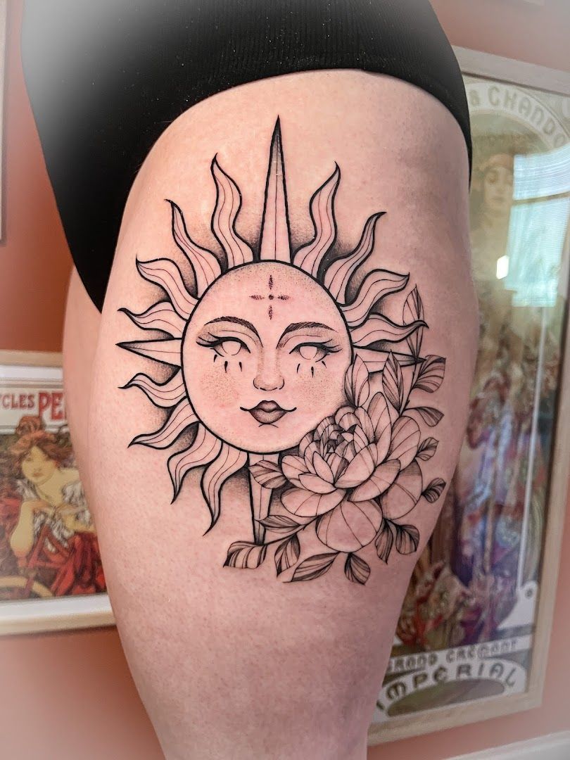 a sun and rose blackwork tattoo on the thigh, rhein-neckar-kreis, germany