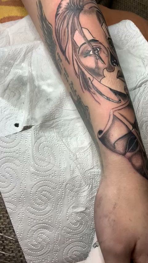a narben tattoo of a woman with a face on her arm, osterholz, germany