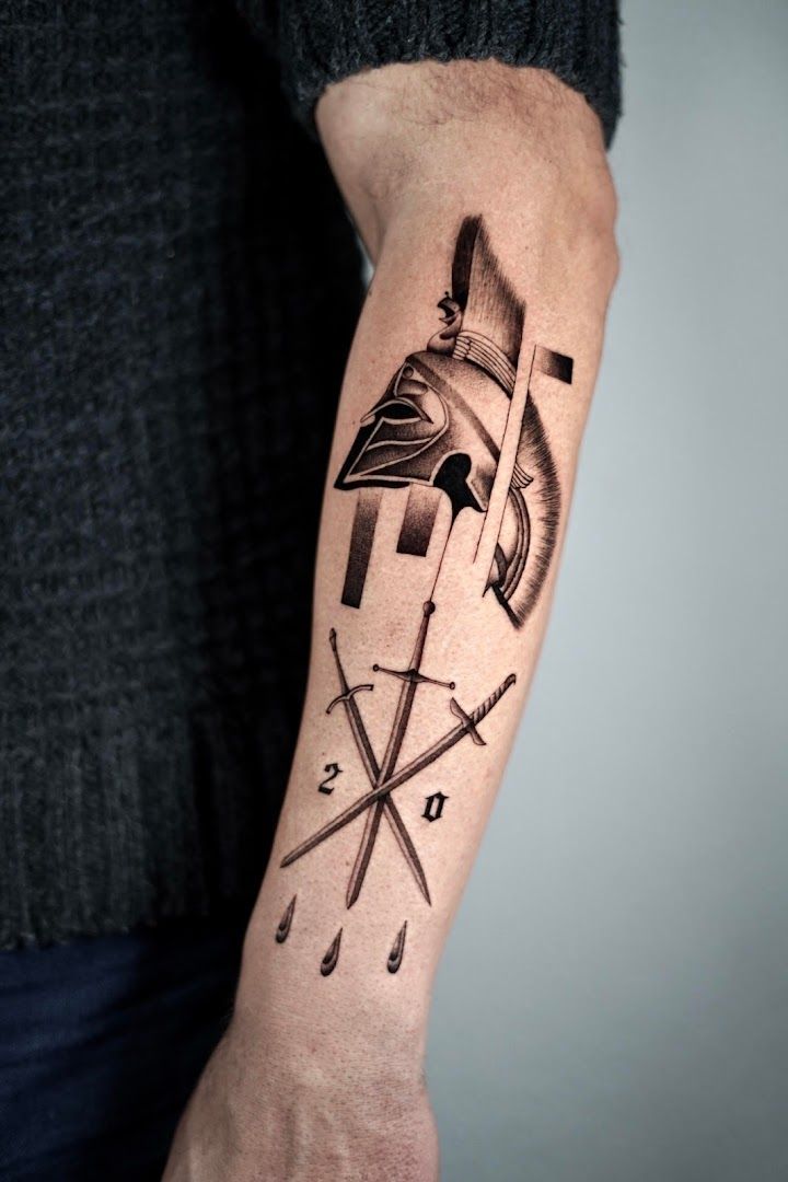 a man's forearm cover-up tattoo with a spartan helmet and arrows, bodenseekreis, germany