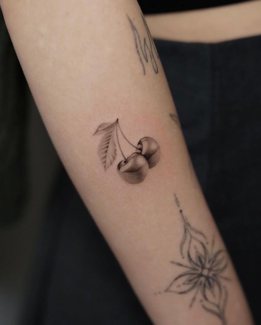 a woman's arm with a small narben tattoo on it, berlin, germany