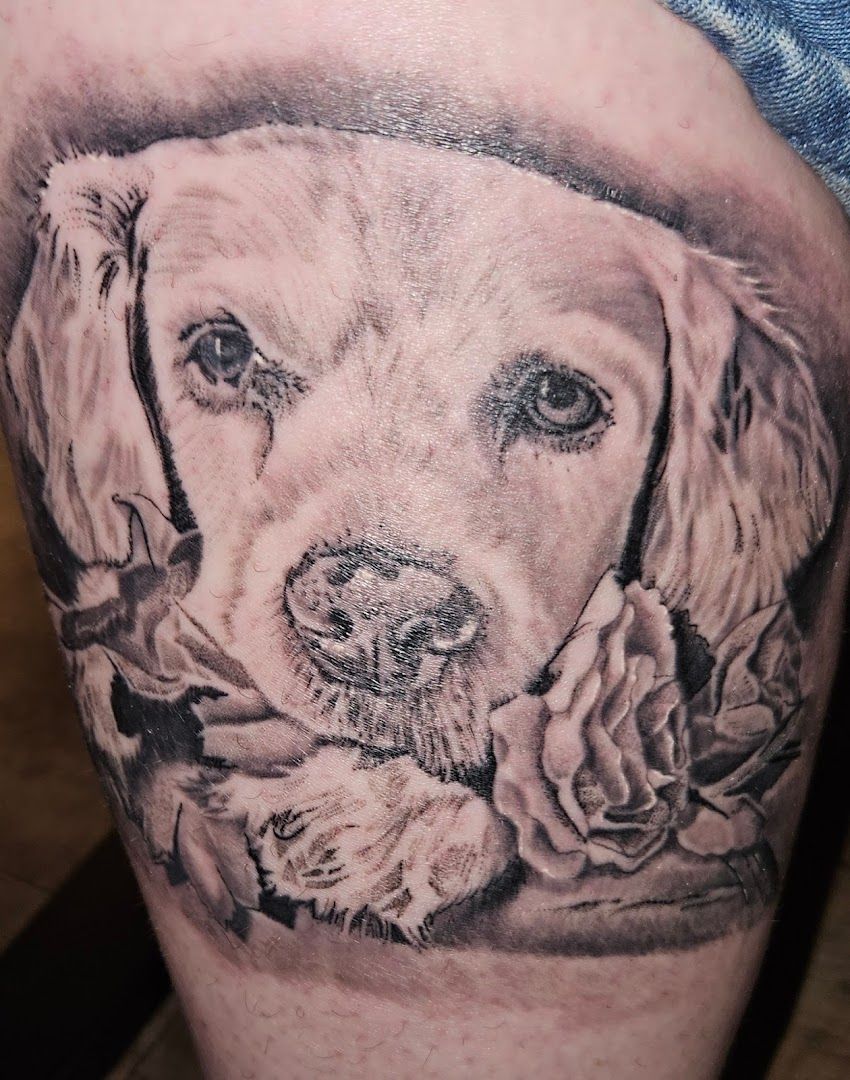 a black and white cover-up tattoo of a dog with roses, kronach, germany