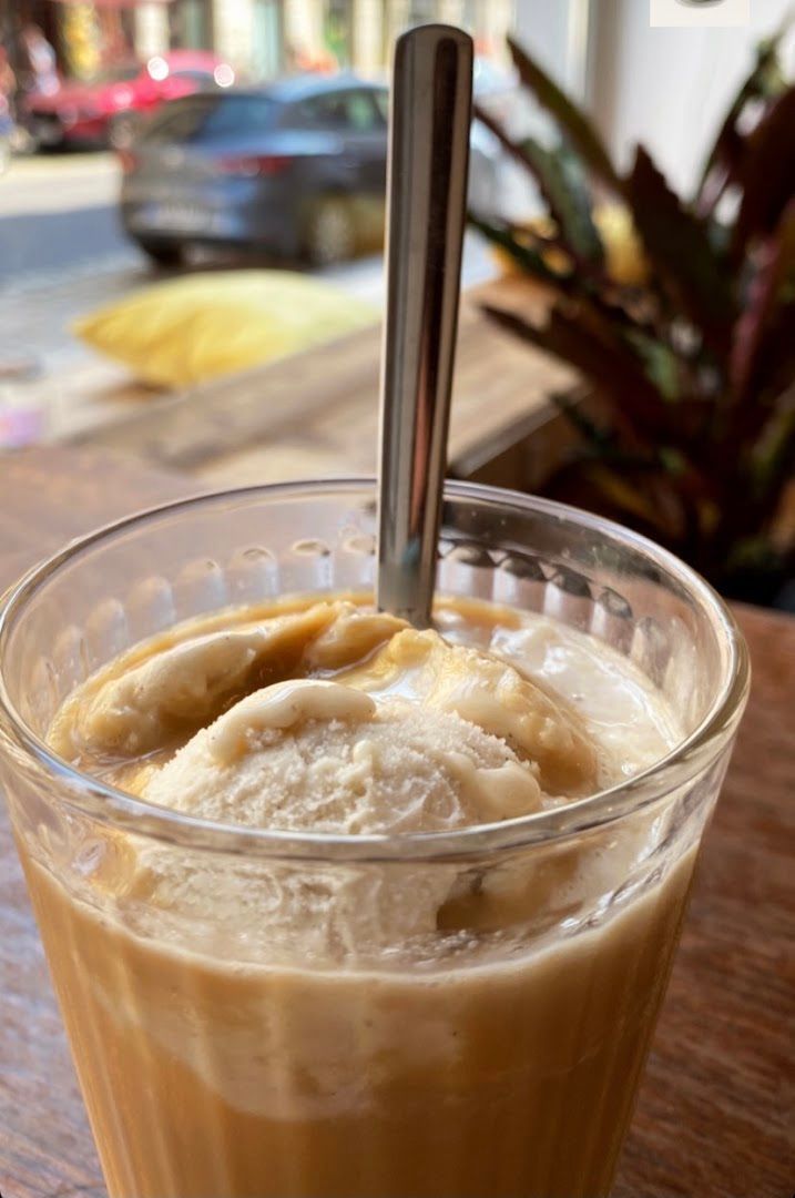 a glass of iced coffee with banana slices