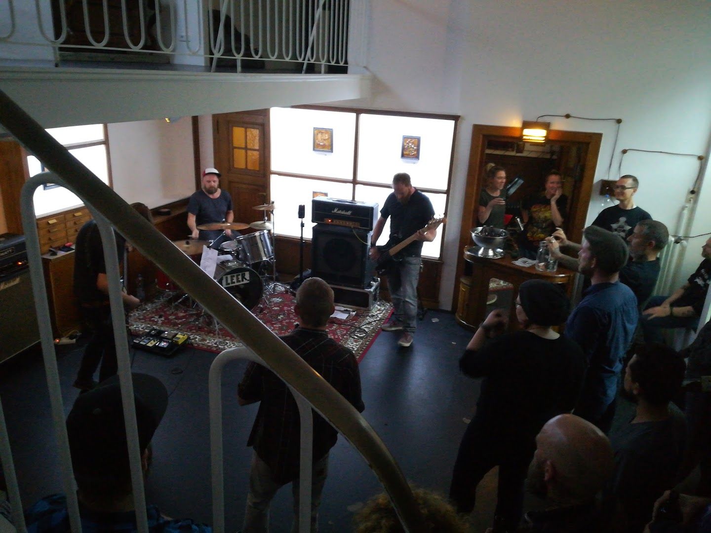 a group of people standing around a staircase