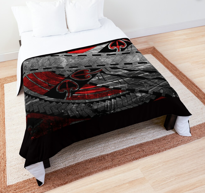 a bed with a red and black design