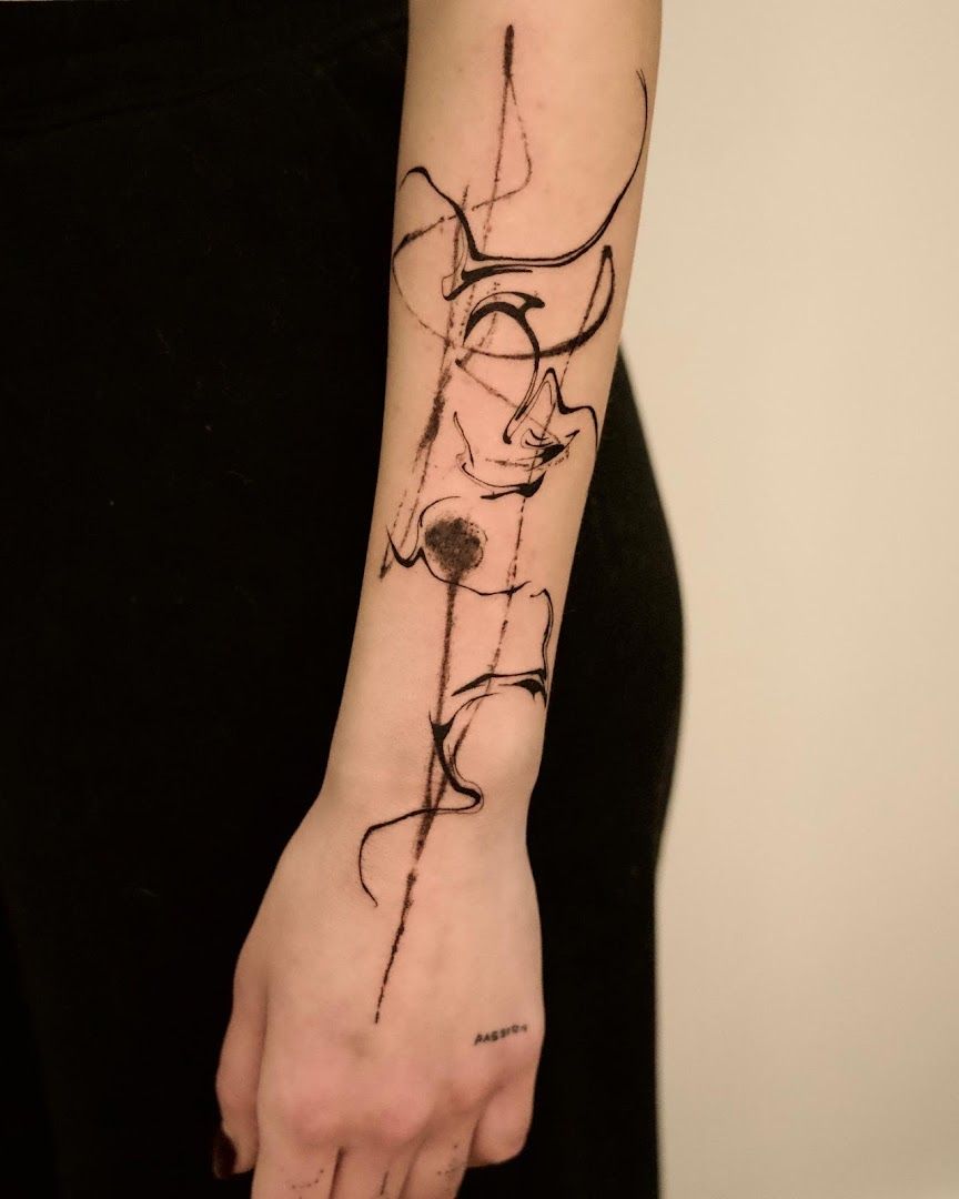 a woman's arm with a black ink narben tattoo, frankfurt, germany