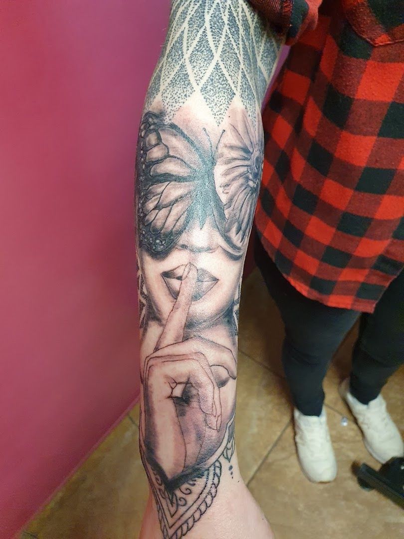 a woman's arm with a cover-up tattoo design on it, görlitz, germany