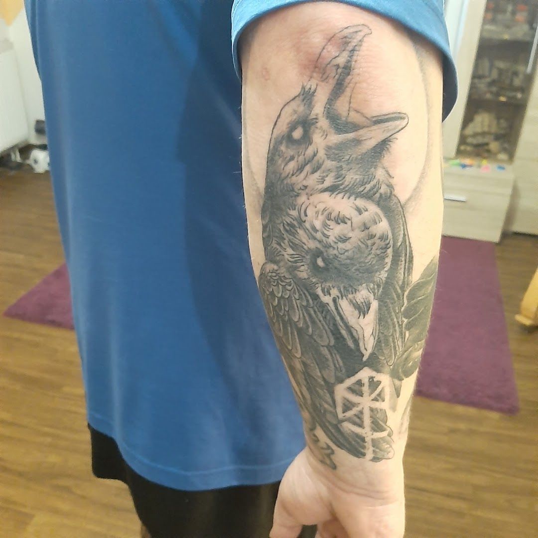 a man with a cover-up tattoo on his arm, frankfurt, germany