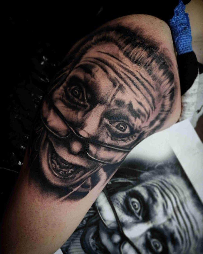 a black and white cover-up tattoo of a clown, zollernalbkreis, germany