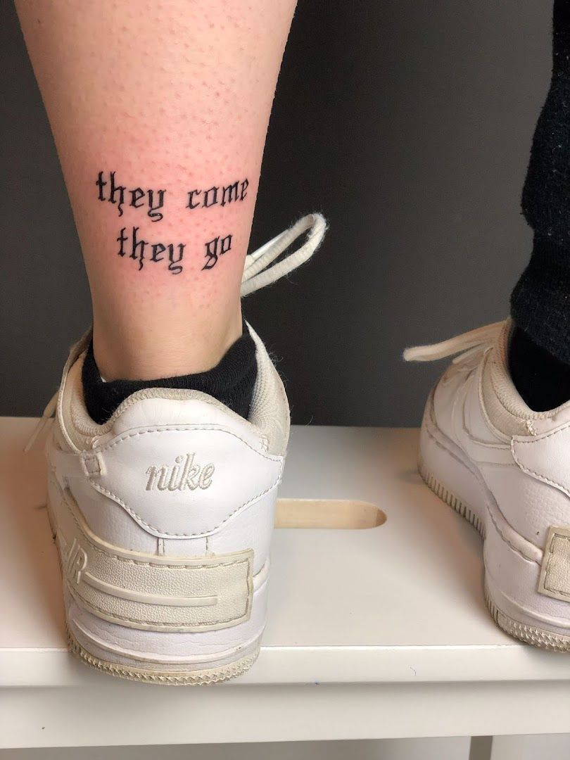 a woman's foot with a cover-up tattoo saying they can't they're, bochum, germany