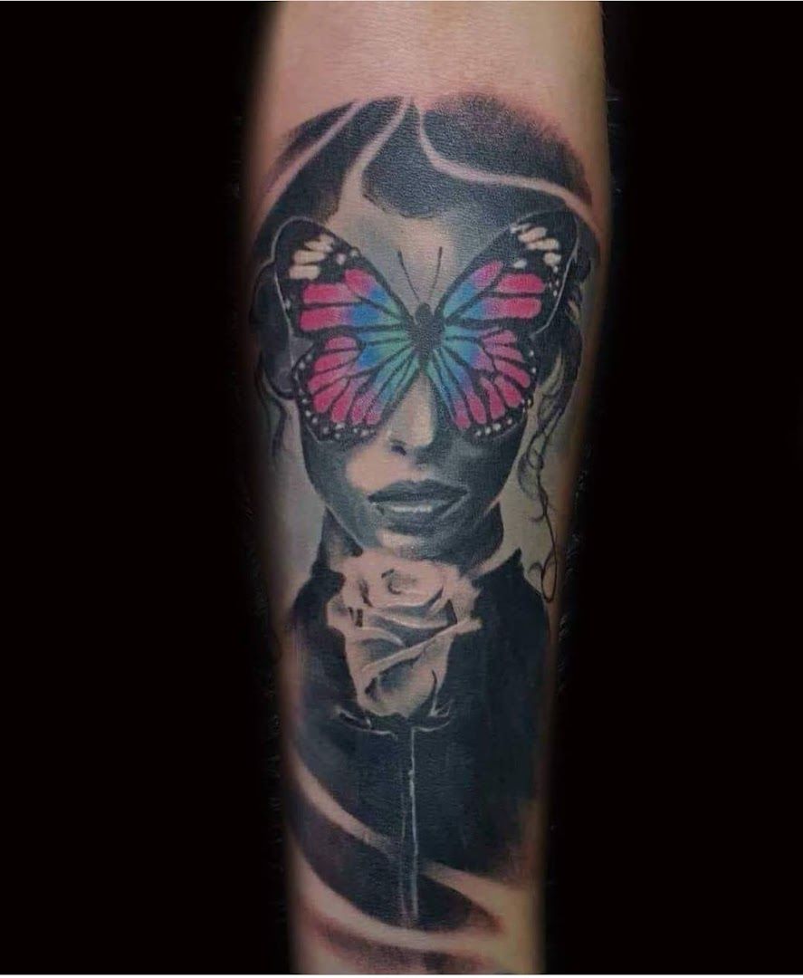 a narben tattoo of a woman with a butterfly on her head, frankfurt, germany