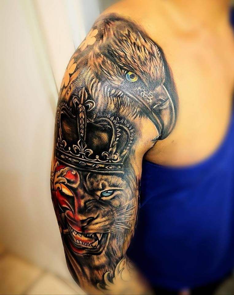 a japanische tattoos in leipzig of a lion with a crown on his head, bonn, germany
