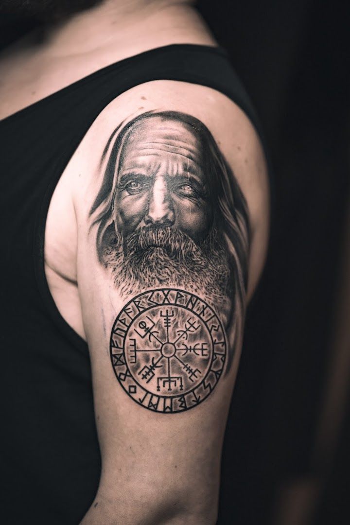 a man with a viking cover-up tattoo on his shoulder, bad kreuznach, germany