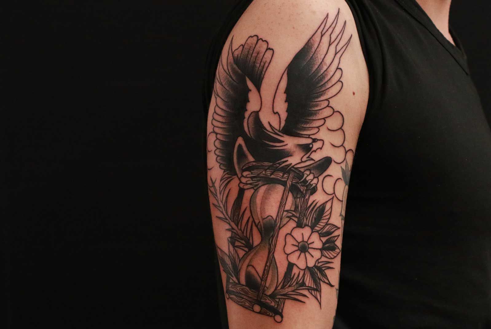 a narben tattoo of a bird and flowers, berlin, germany