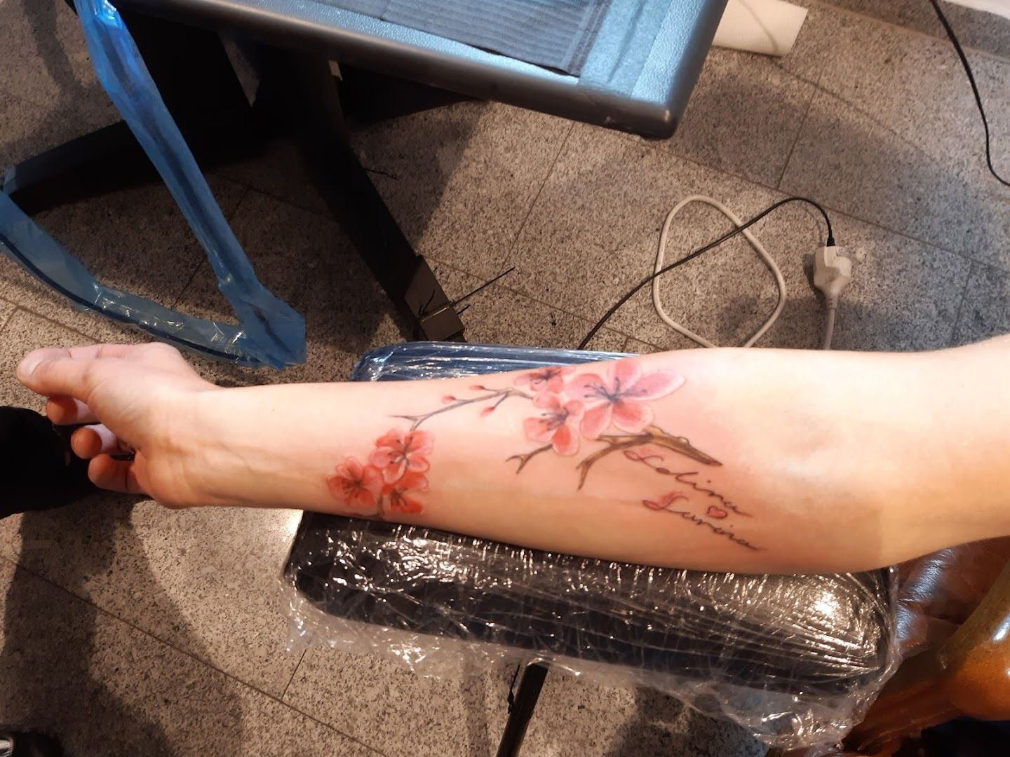 a person with a narben tattoo on their arm, rhein-kreis neuss, germany