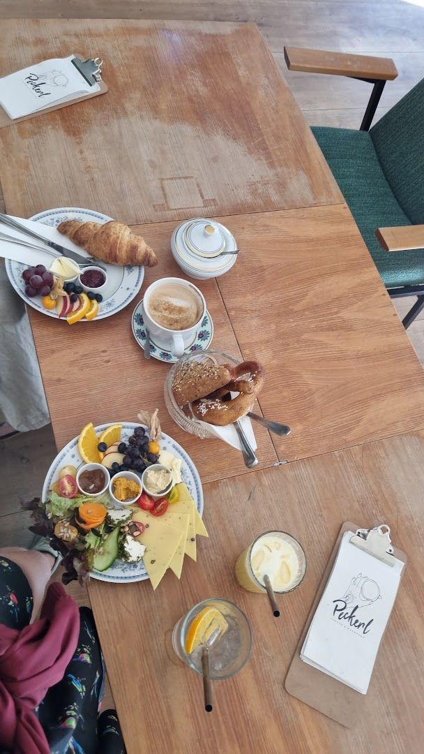 a table with plates of food and drinks on it