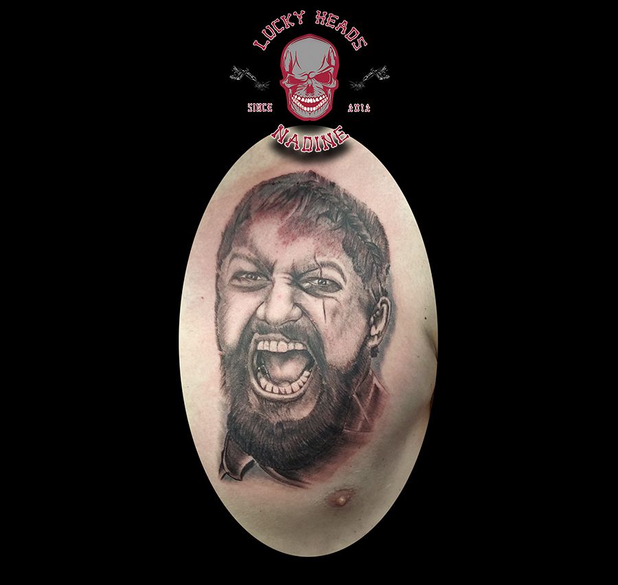 a cover-up tattoo of a man with a beard and a beard, steinburg, germany