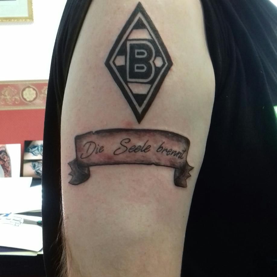 a narben tattoo with a banner and a ribbon, böblingen, germany