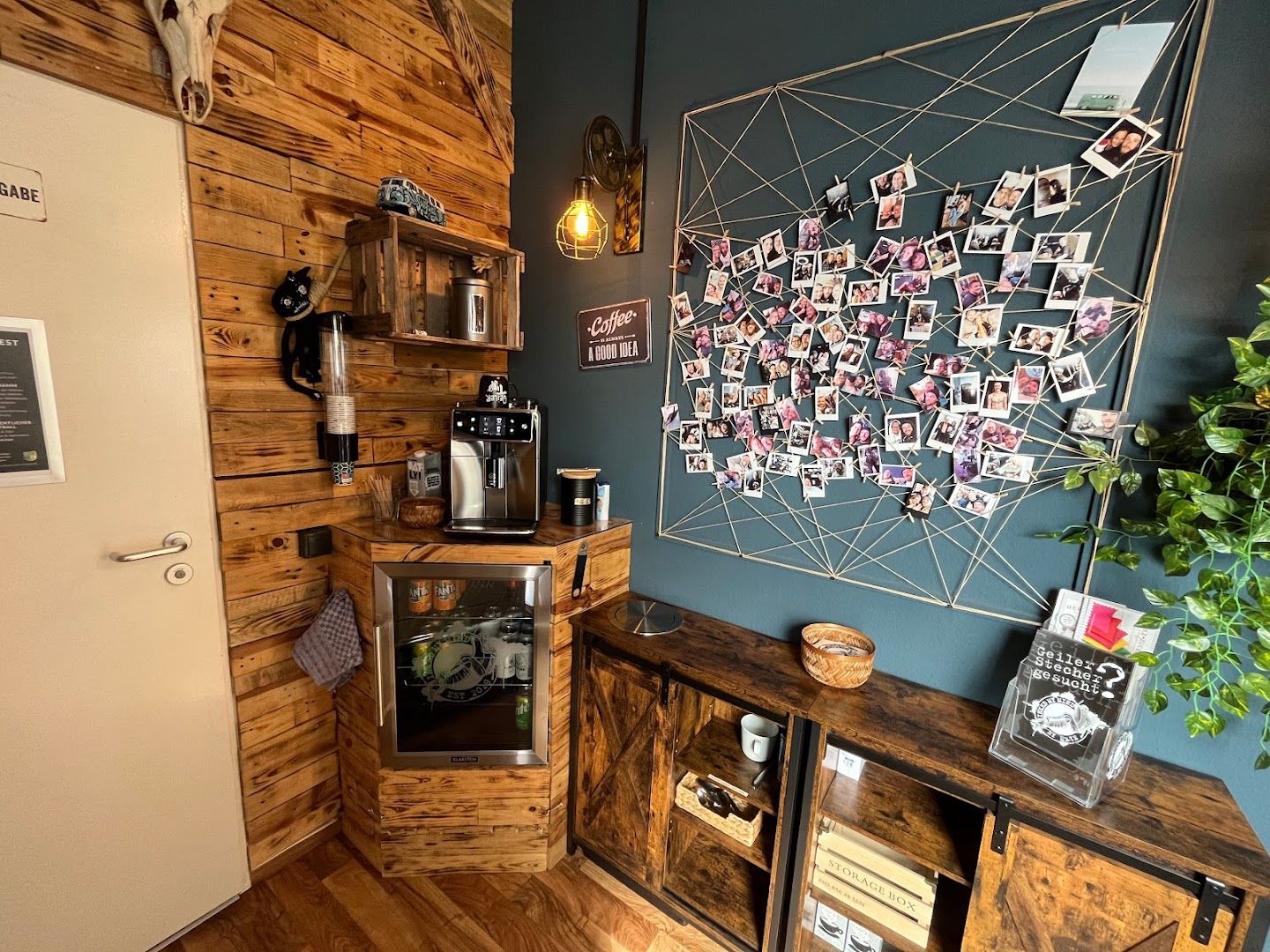 a small kitchen with a wooden wall and a wooden cabinet