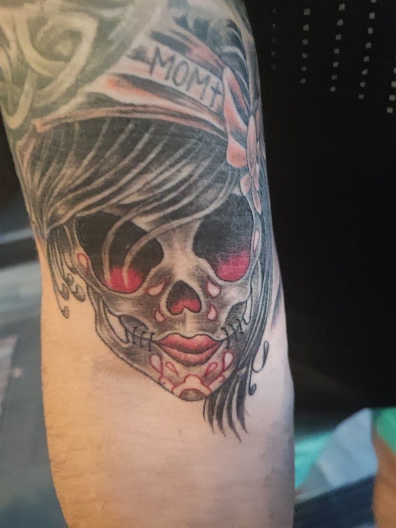 a cover-up tattoo of a skull with a red eye, mittelsachsen, germany