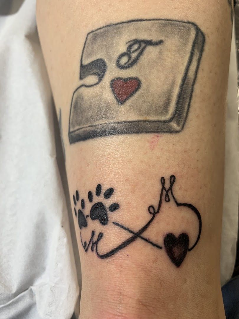 a narben tattoo with a heart and a book on it, konstanz, germany