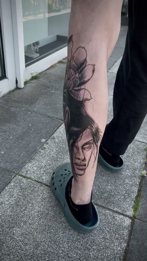 a cover-up tattoo of a woman's face on the leg, minden-lübbecke, germany