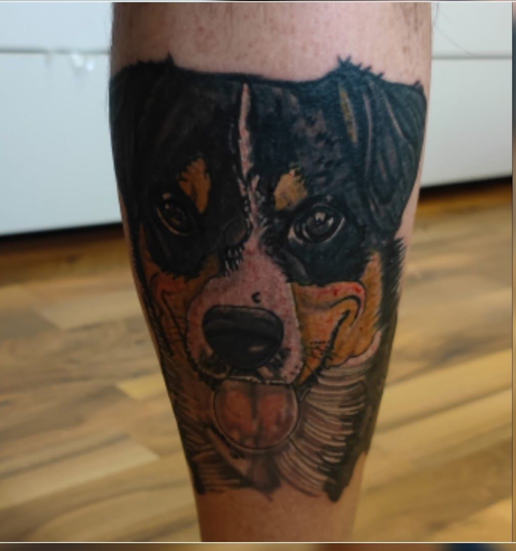 a narben tattoo of a dog on the leg, ravensburg, germany