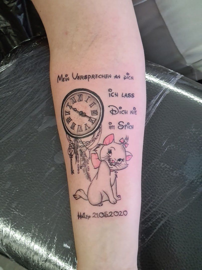 a cover-up tattoo with a clock and a dog, neustadt (aisch)-bad windsheim, germany