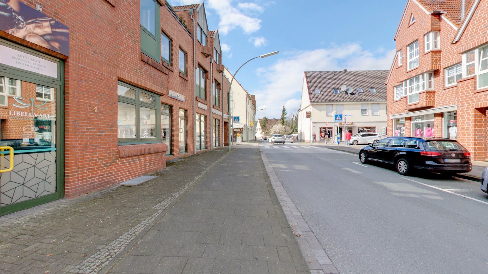 a street with cars parked on the side