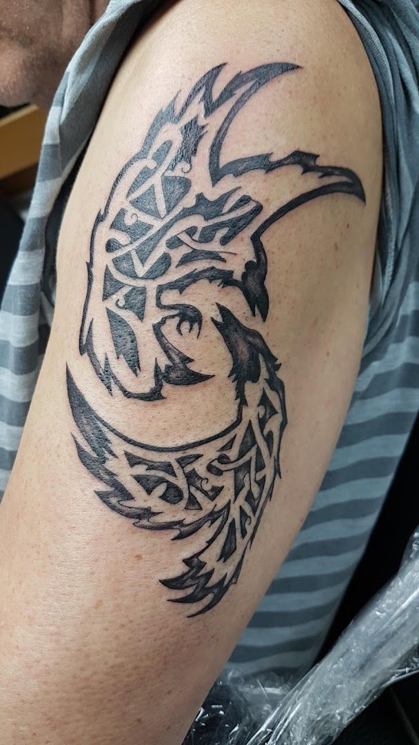 a man with a cover-up tattoo on his arm, bad kreuznach, germany