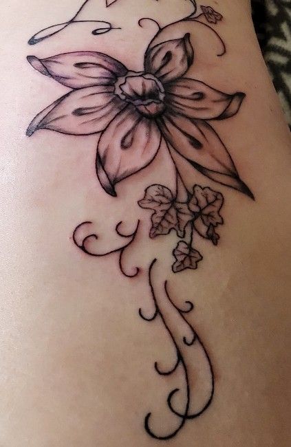 a narben tattoo design with a flower on the side, rotenburg (wümme), germany