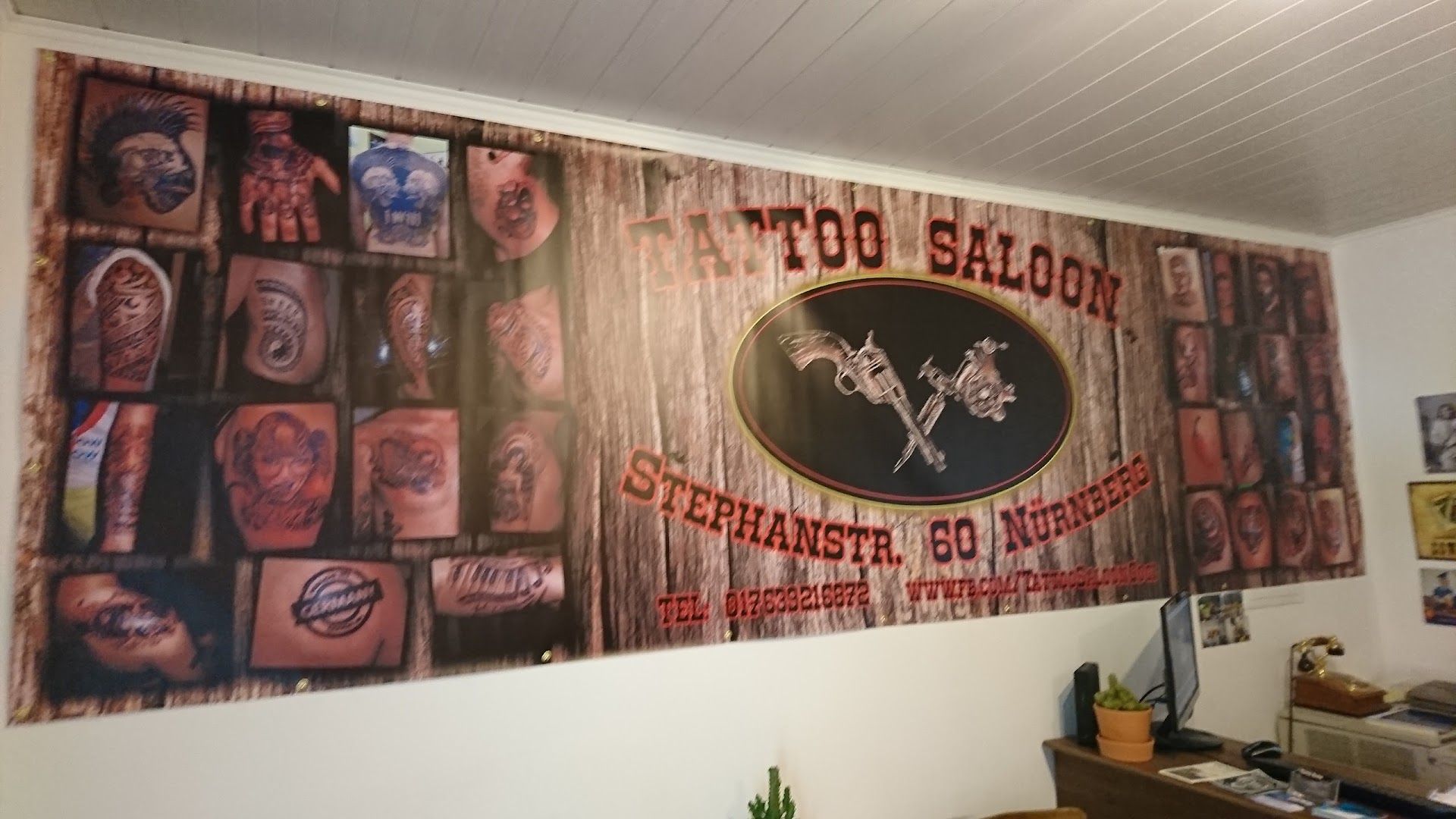 a wall with a sign that says to saloon