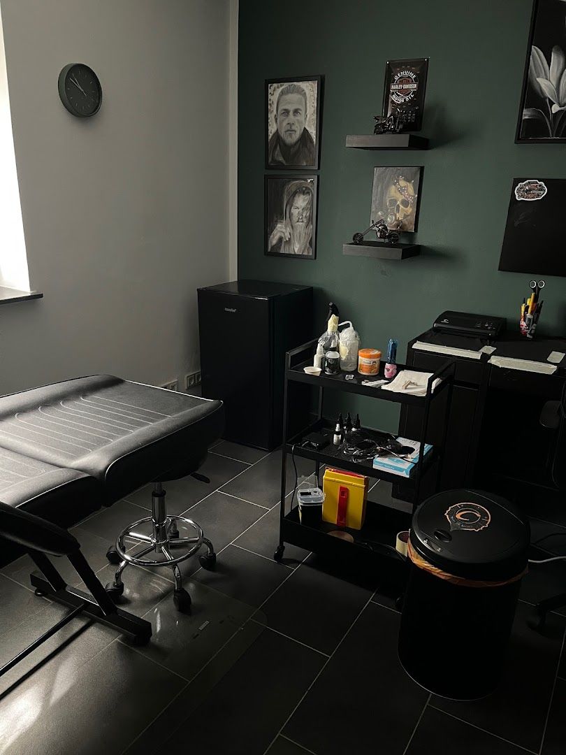 a room with a bed, desk, and a chair