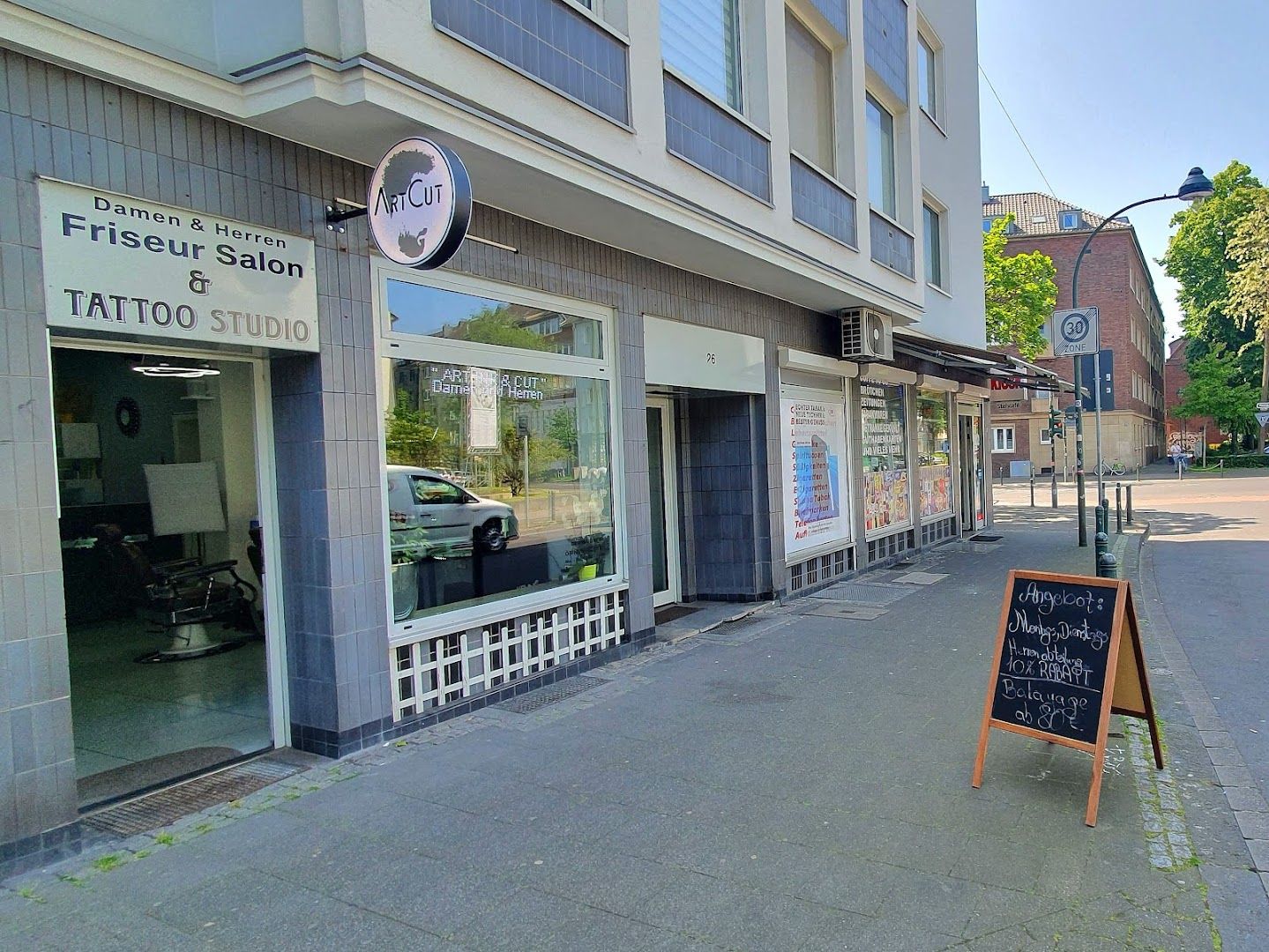 a sign is on the sidewalk outside of a restaurant