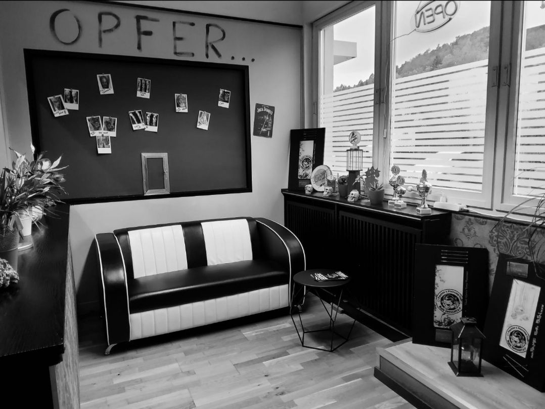 a black and white photo of a room with a couch