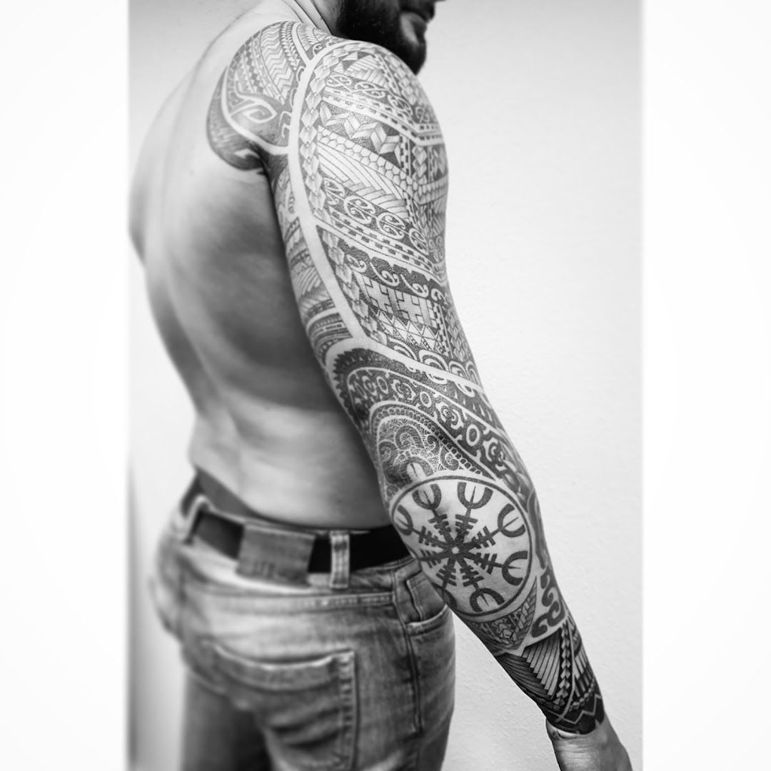 a man with a cover-up tattoo on his arm, paderborn, germany