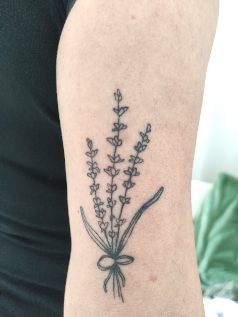 a cover-up tattoo with a flower on the arm, viersen, germany