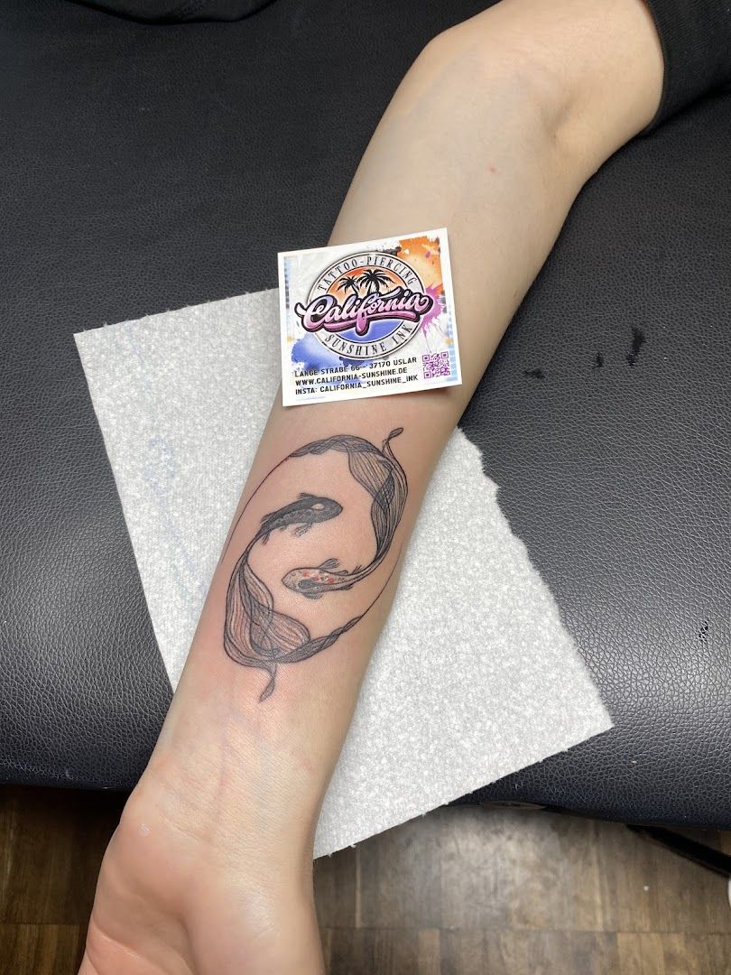 a narben tattoo of a woman's face on the wrist, northeim, germany