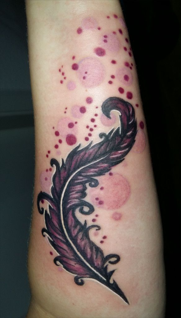 a narben tattoo with a feather on the arm, oder-spree, germany