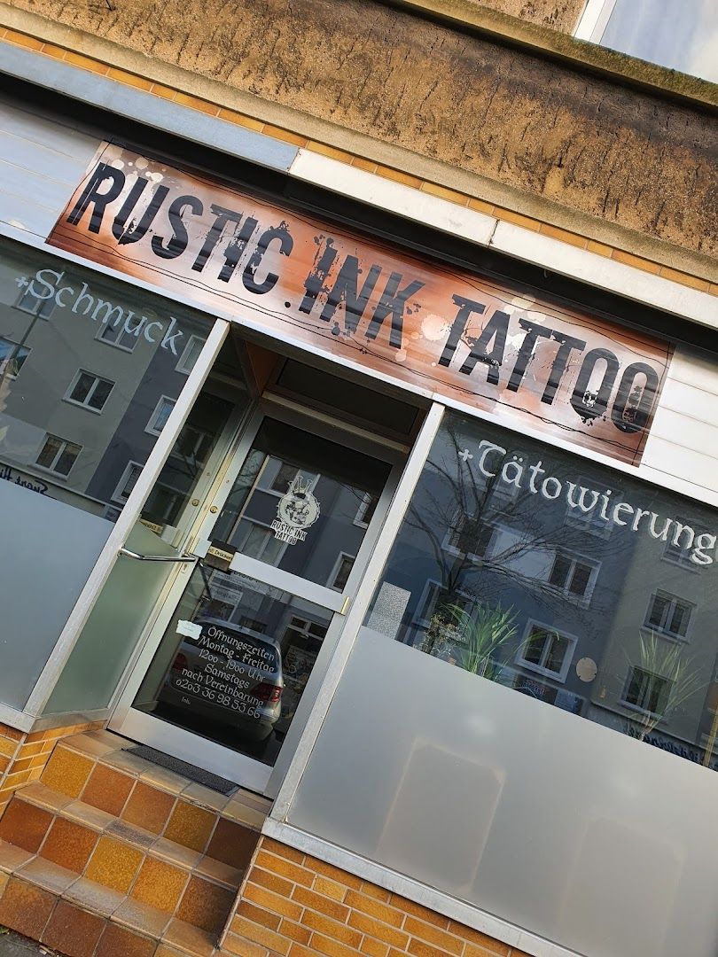 a building with a sign that says rush cover-up tattoo, duisburg, germany