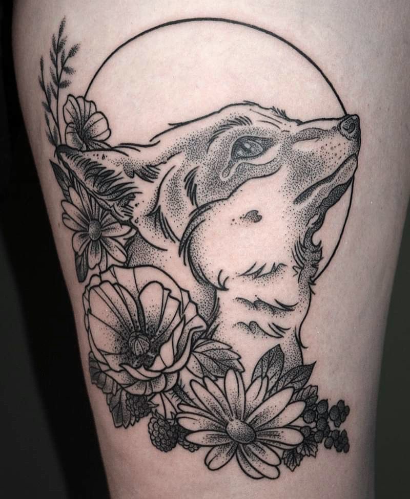 a wolf with flowers on his leg